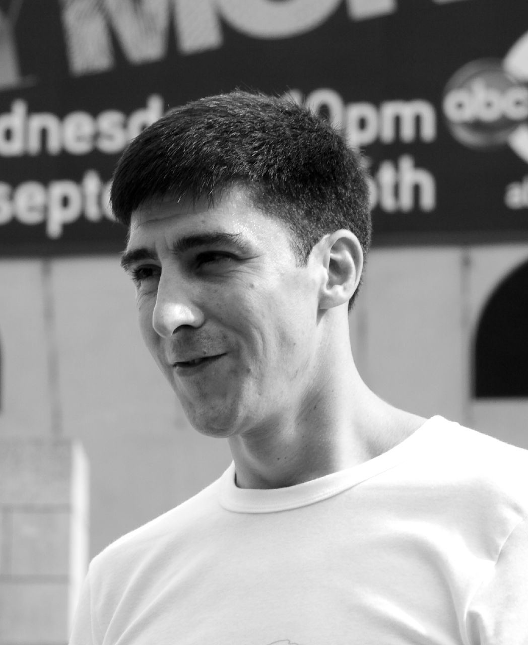 Black and white portrait of parkour pioneer David Belle smiling